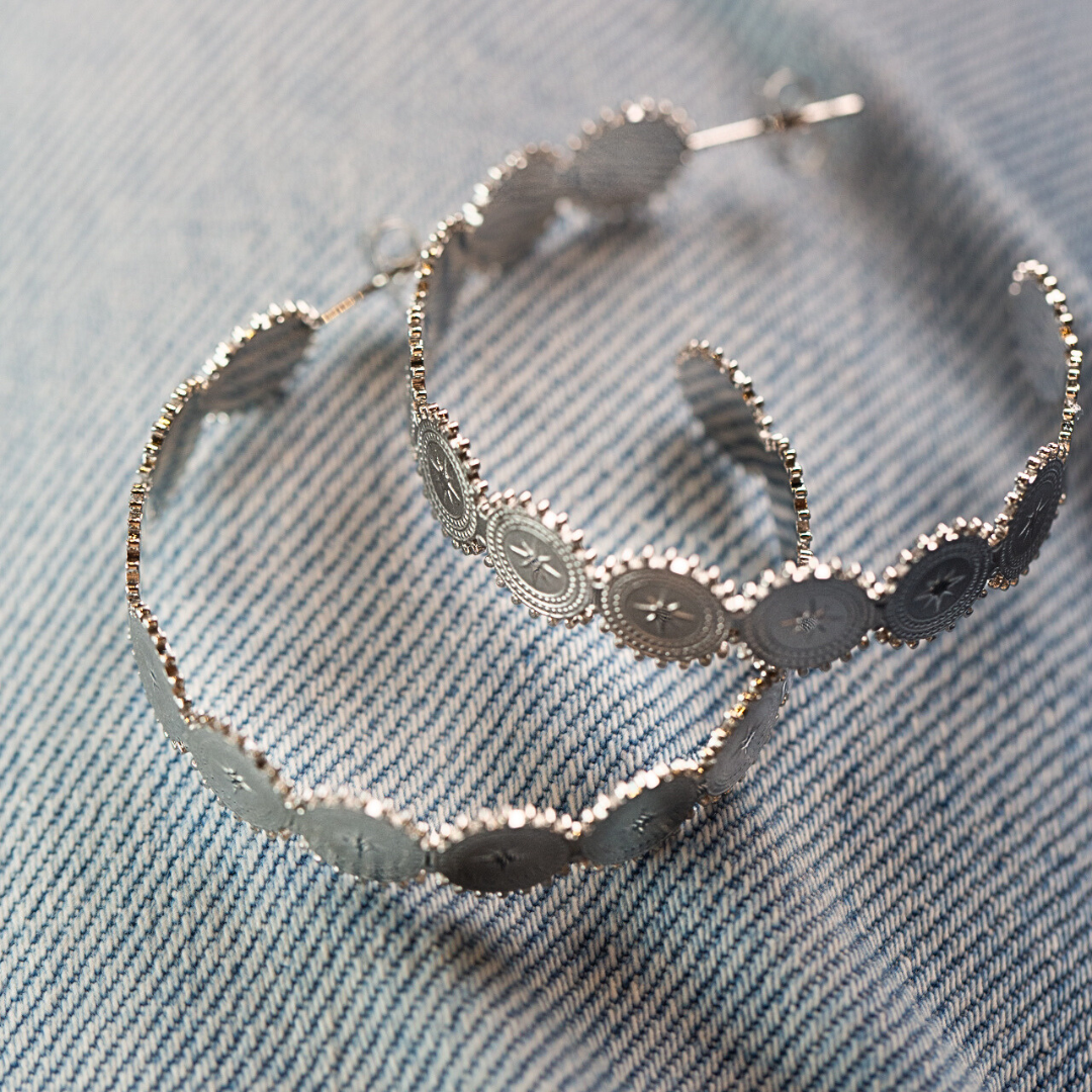 Star embossed silver hoops