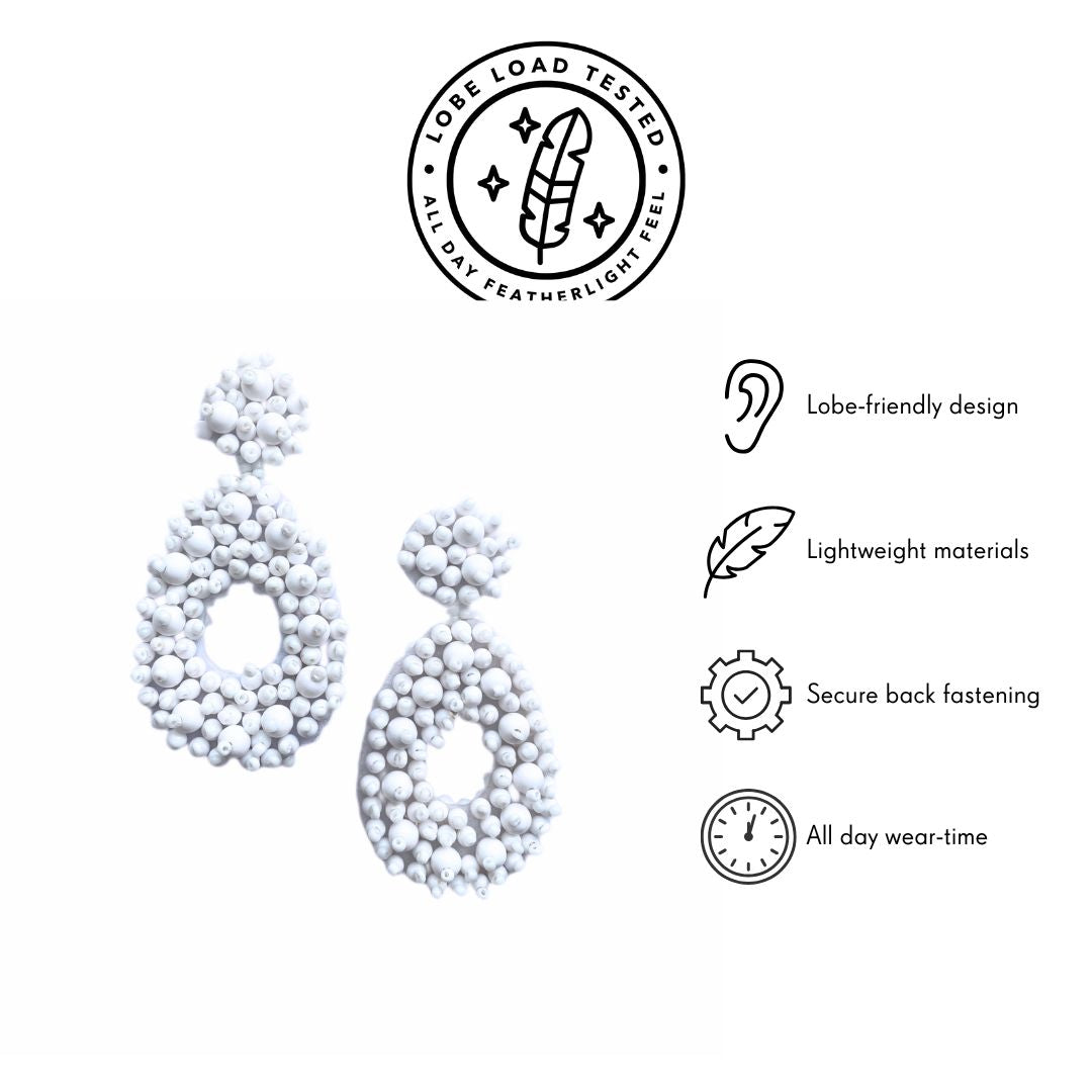 White beaded statement earrings