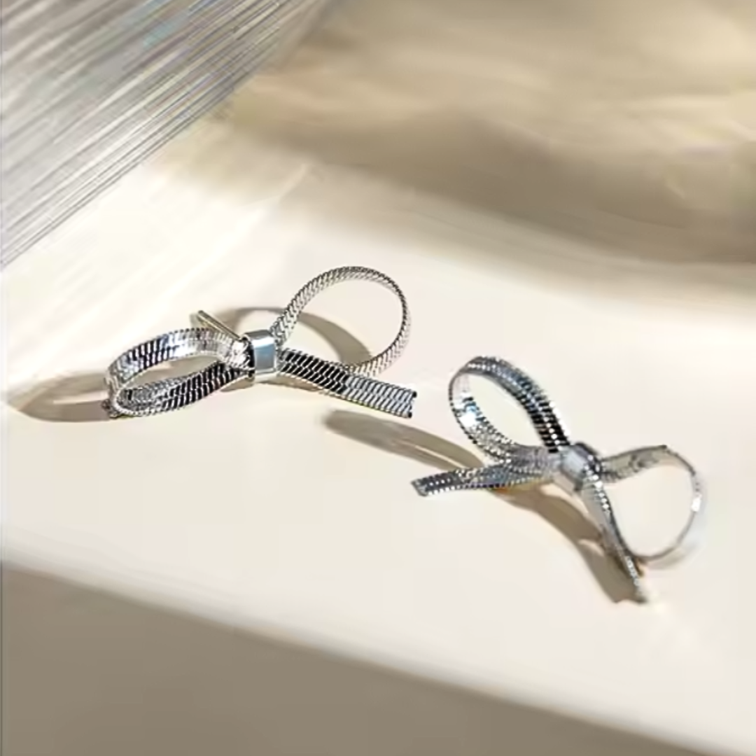 KELLY silver tone bow stud earrings