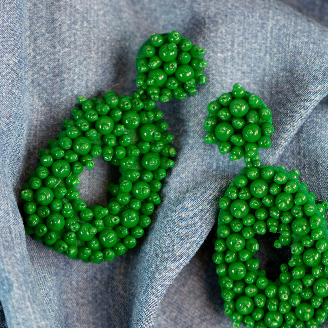 Green beaded statement earrings