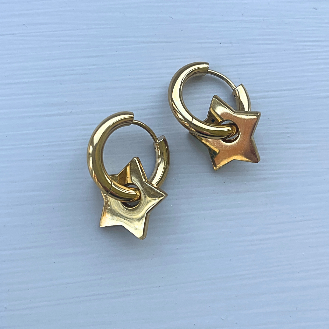 Gold star huggies with green sparkle