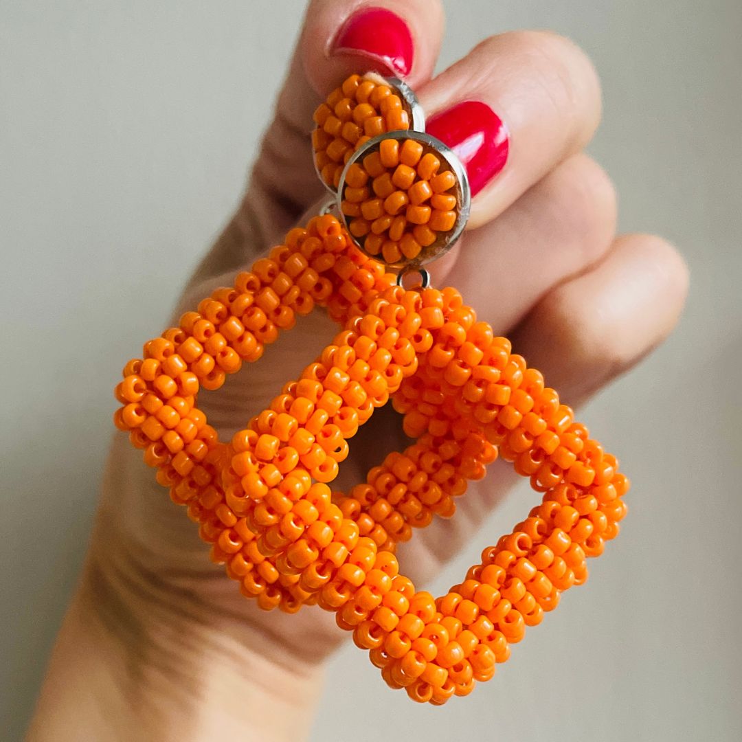 Orange beaded statement earrings