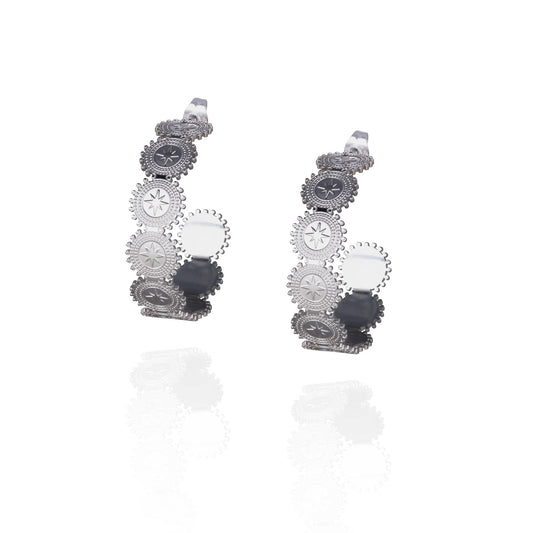 Pair of silver hoop earrings with circular star design