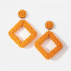 Pair of orange beaded dangle earrings with large stud and square pendant  