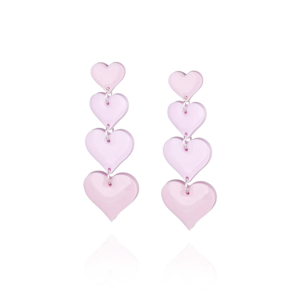 Pair of statement drop pendant earrings featuring four pink hearts increasing in size 