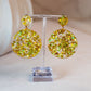 Yellow disco dangle earrings