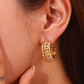 Gold chunky hoops with heart detail