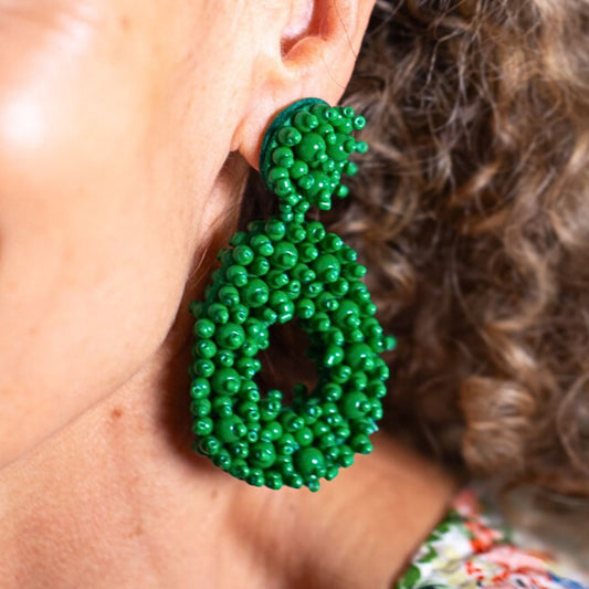 Green beaded statement earrings