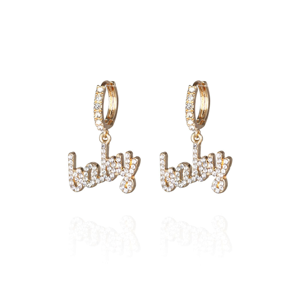 Pair of small pierced huggie hoop crystal earrings with a baby word pendant 