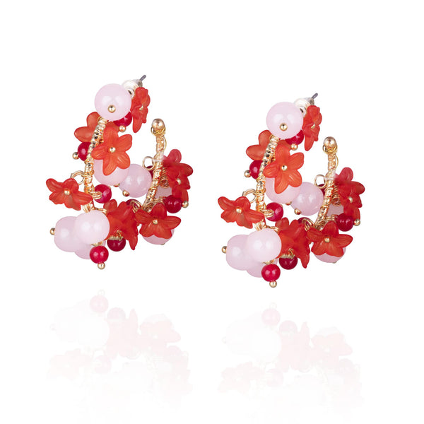 Pair of golden hoop earrings with red and pink beaded flower design