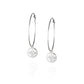Pair of large, thin silver hoop earrings with round embossed pendant with star detail