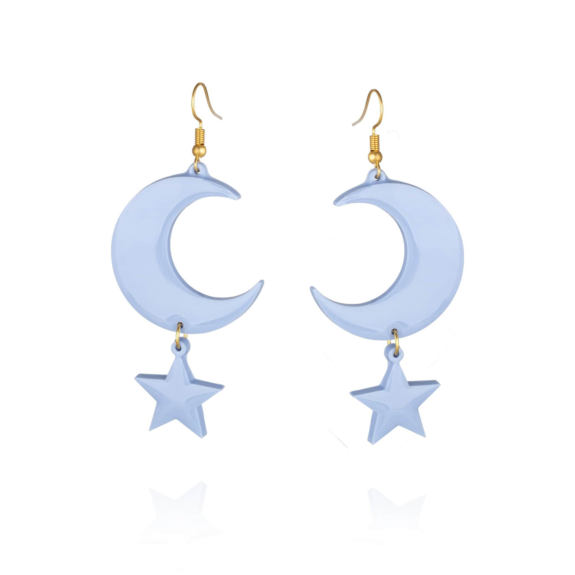 Pair of pale blue resin statement pierced earrings with gold hook clasp and moon and star shaped pendant design