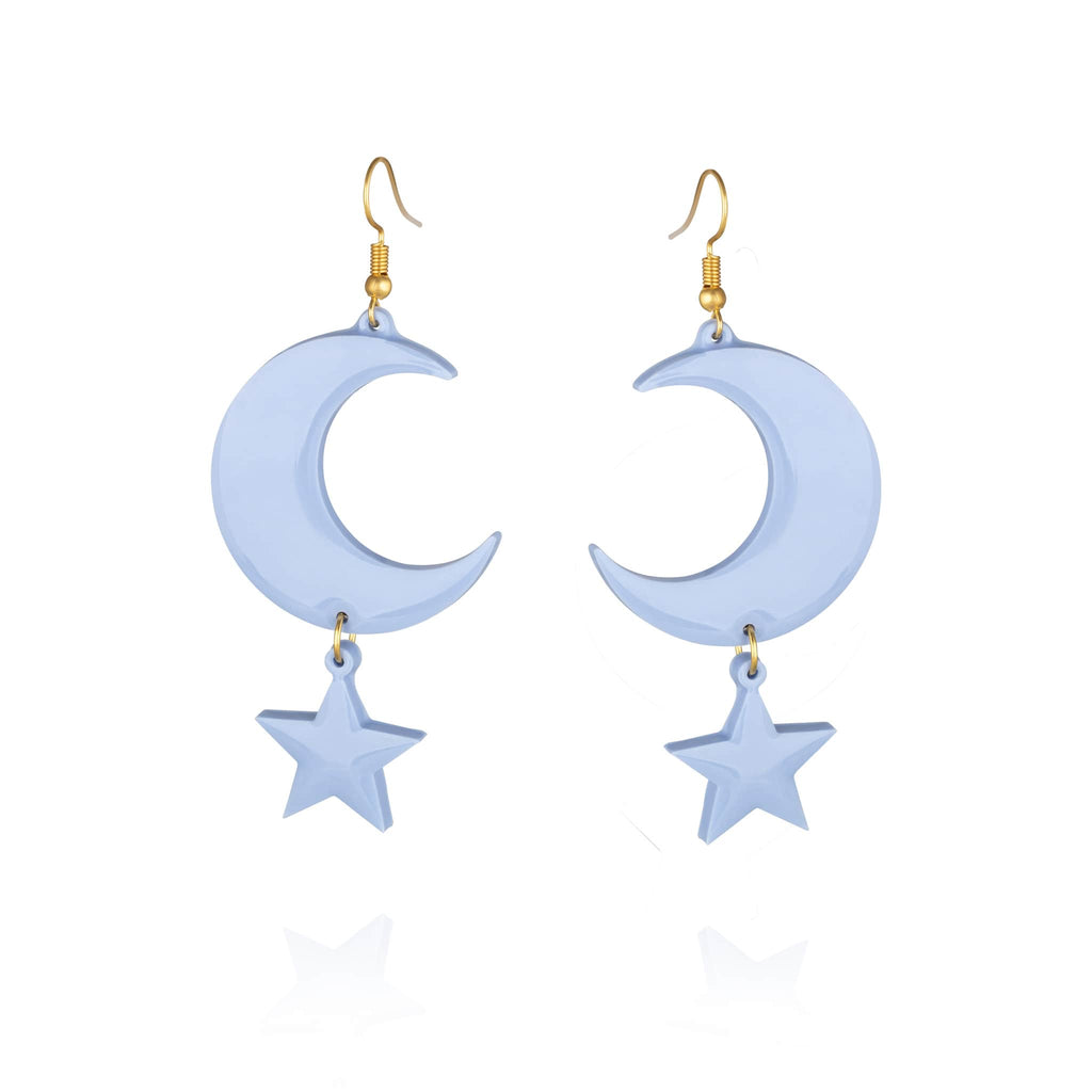 Pair of pale blue resin statement pierced earrings with gold hook clasp and moon and star shaped pendant design